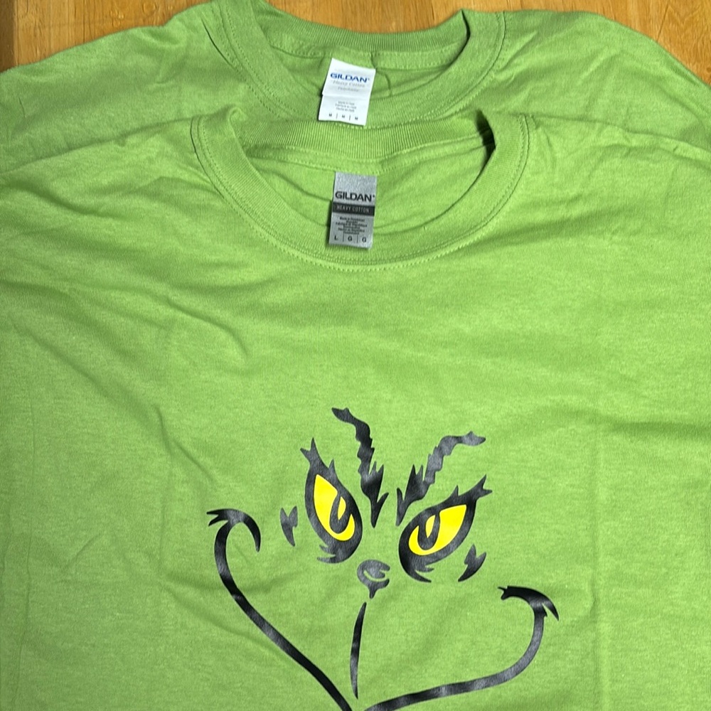 One med, one Large grinch tshirts